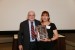 Dr. Nagib Callaos, General Chair, giving Dra. Fátima Dolz de Moreno a plaque "Por su Excelente Ponencia Plenaria."